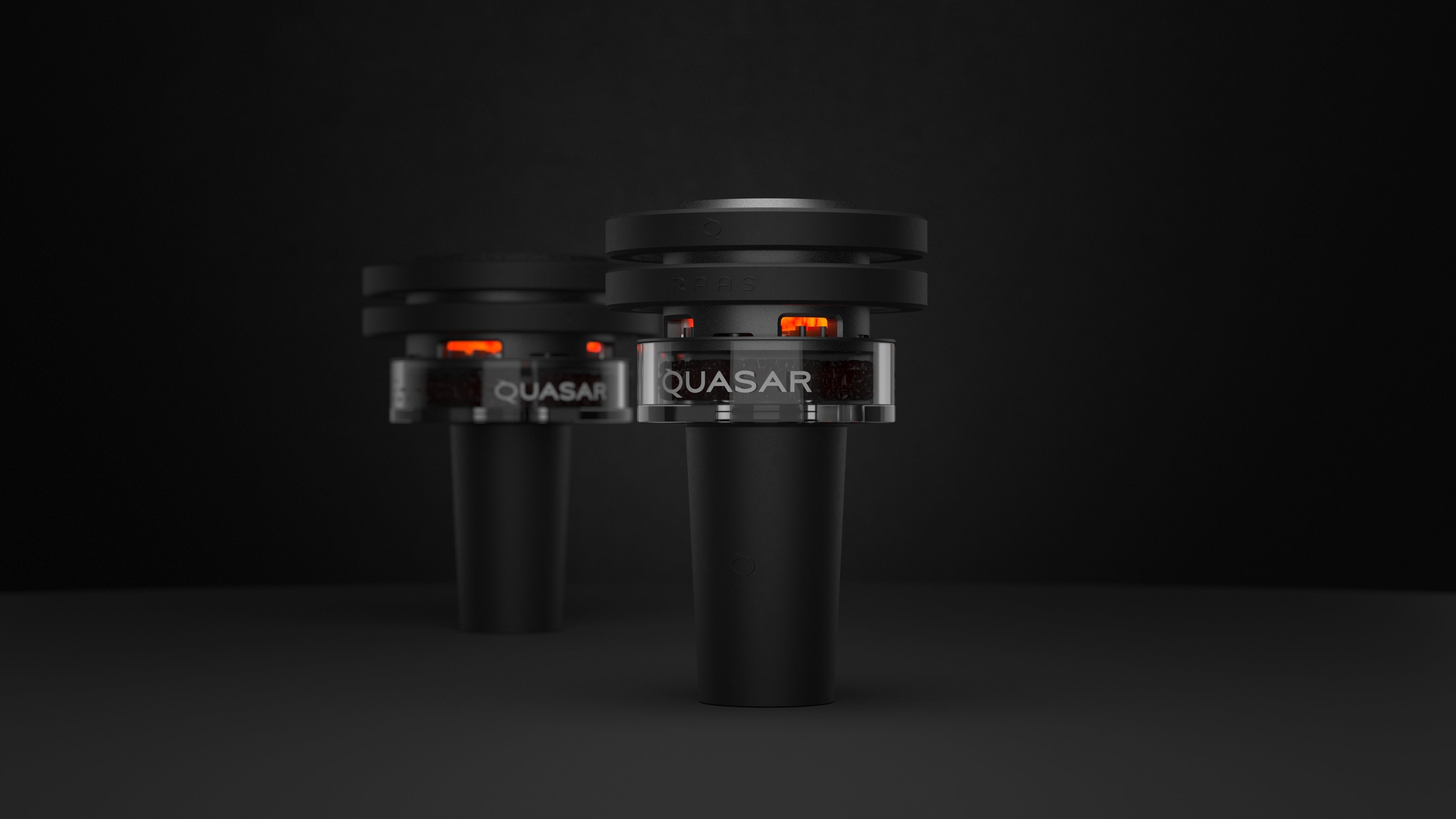 Quasar Petit Raas 2 and original Raas 2 both glowing with coals, side by side comparison

