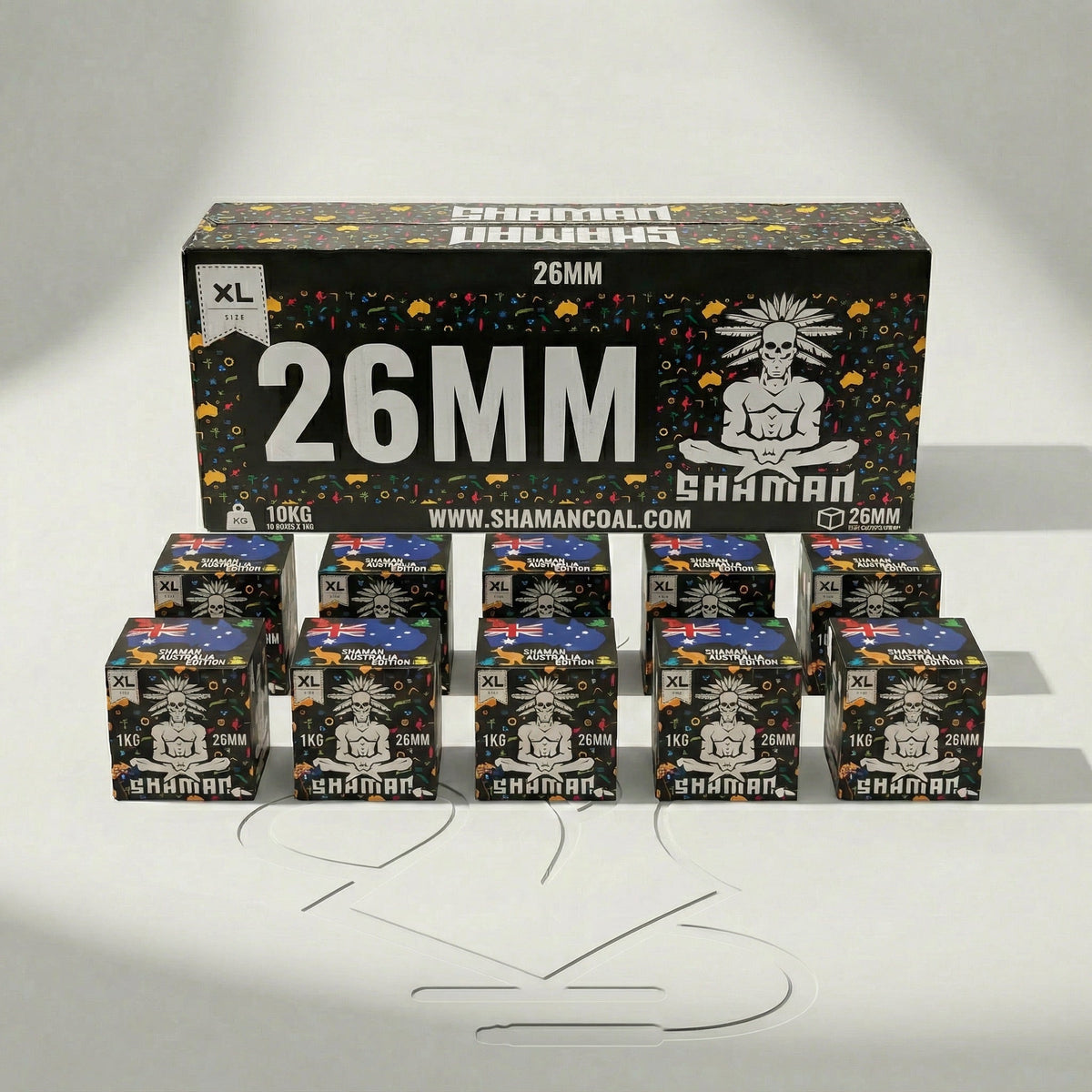 Shaman 26mm coconut charcoal 10kg master box at a three-quarter angle showing the front face and Australia Edition side panel in a professional studio setting., image 7 of 15