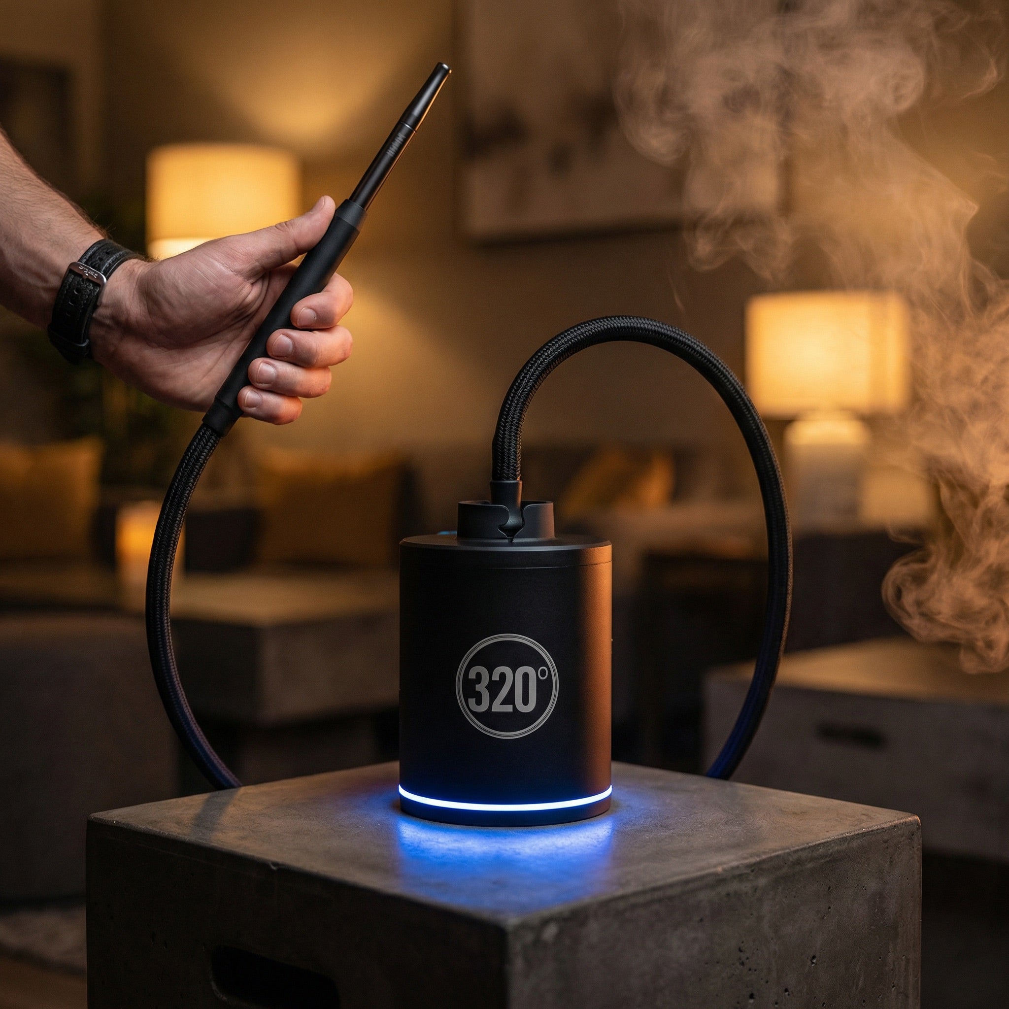 320° LED electric shisha starter pump in use during a hookah session with the LED ring glowing cool blue and a braided hose connected to the top cradle — the automatic draw pump that starts your hookah for you.