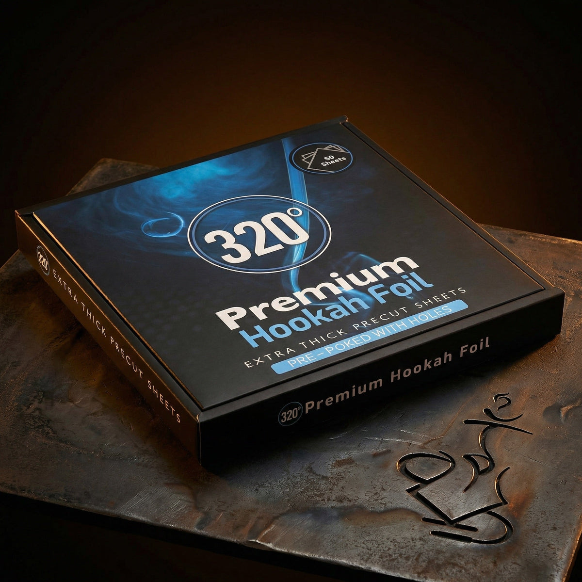 320° Premium Hookah Foil box lit dramatically on a dark forged steel surface, showing the extra thick precut pre-poked shisha foil sheets packaging in warm editorial light., image 2 of 16