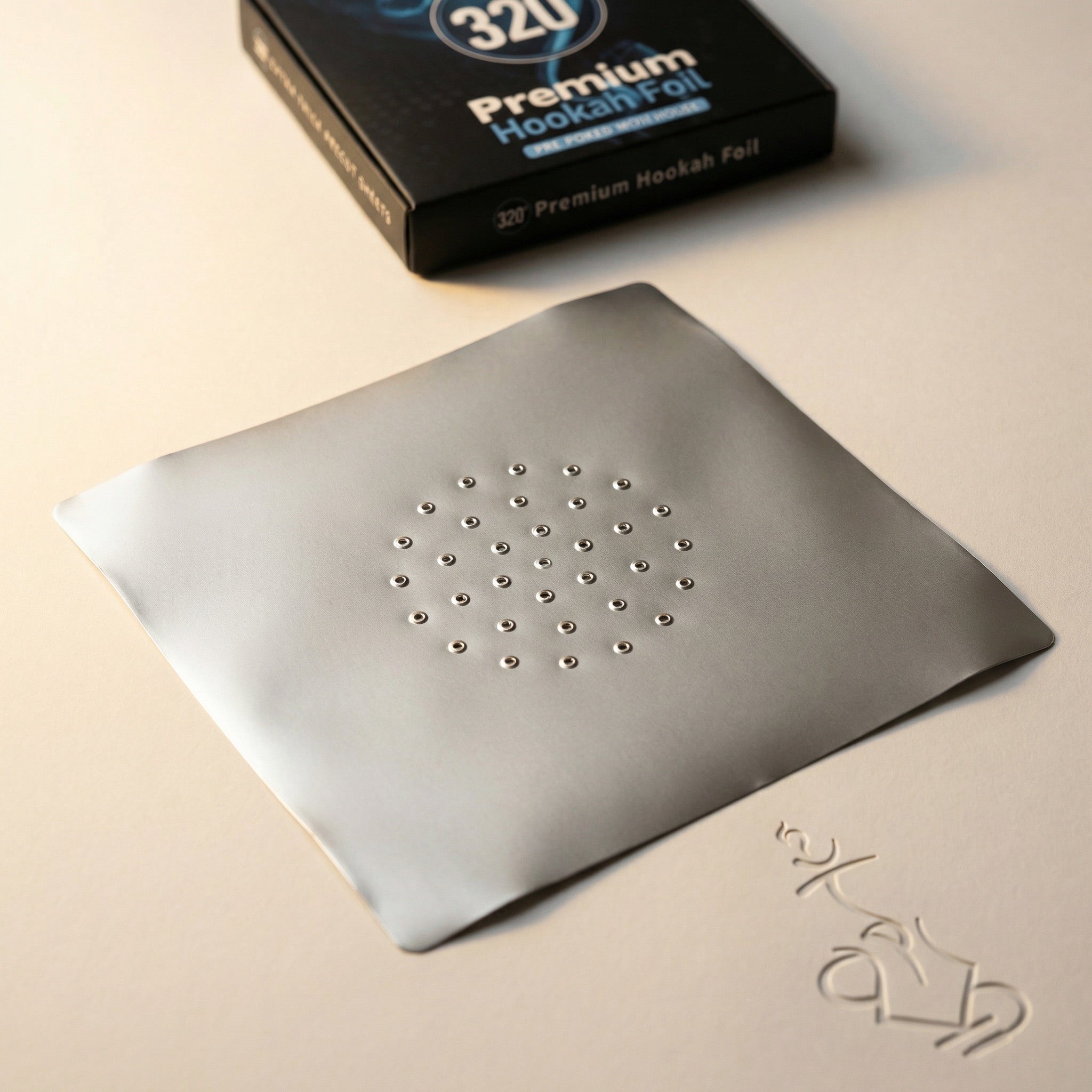 Close-up detail of the 320° Premium Hookah Foil packaging showing the circular logo mark and the blue "Pre-Poked With Holes" ribbon against the blue smoke artwork.