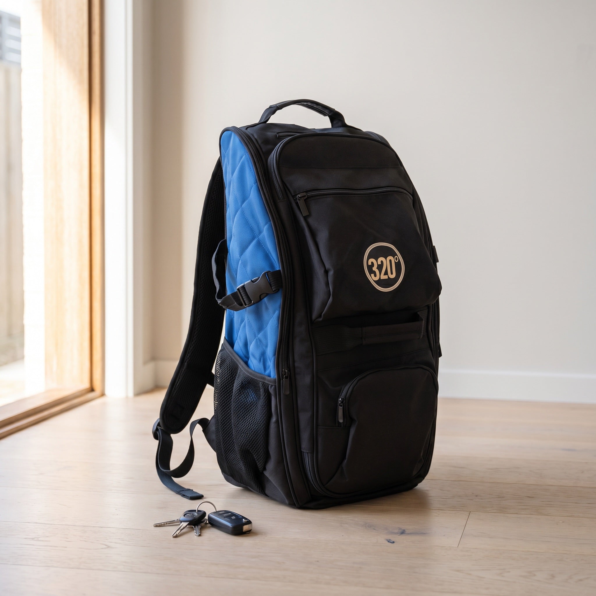 320° Shisha Travel Backpack standing by a home doorway with car keys, packed and ready to go