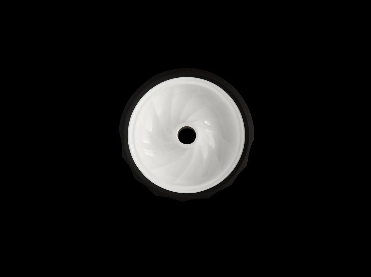 Kaloud Samsaris Lapis II shisha bowl, white ceramic core in a matte black silicone shell, on a black background, image 2 of 3