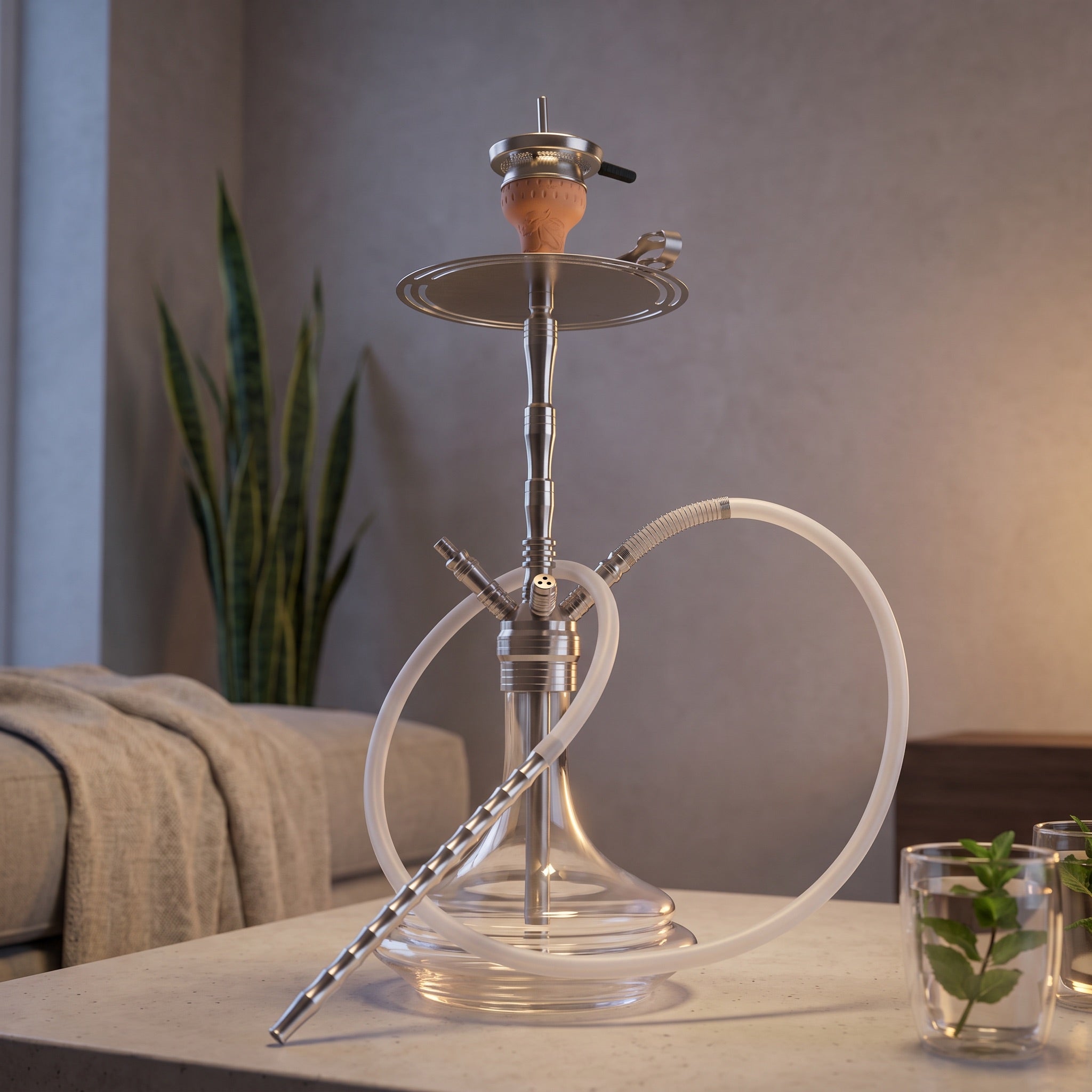 ADMY stainless steel shisha pipe set on a concrete table beside two mint tea glasses in a modern apartment lounge