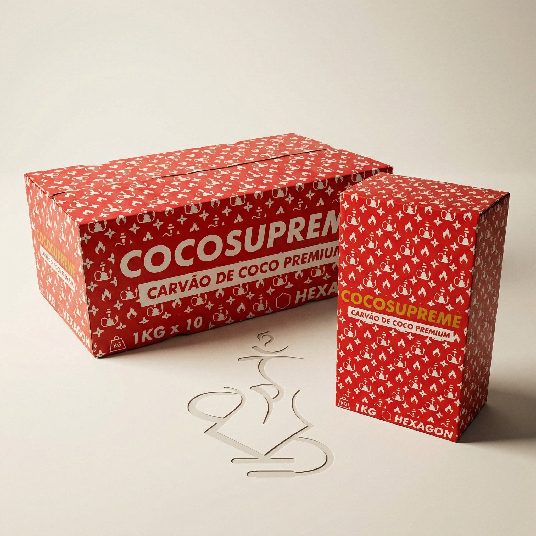 Cocosupreme Hexagon coconut charcoal 1kg and 10kg boxes in bold red packaging together on a warm white studio background showing the size difference between formats.
