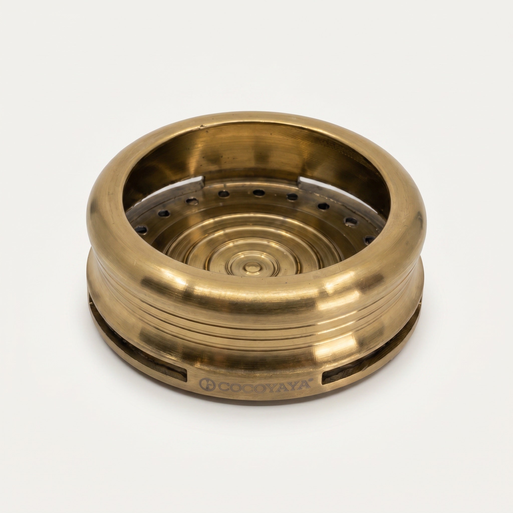 Cocoyaya Pro 5 chamber interior showing heat plate with concentric rings and perforated holes, brushed gold body