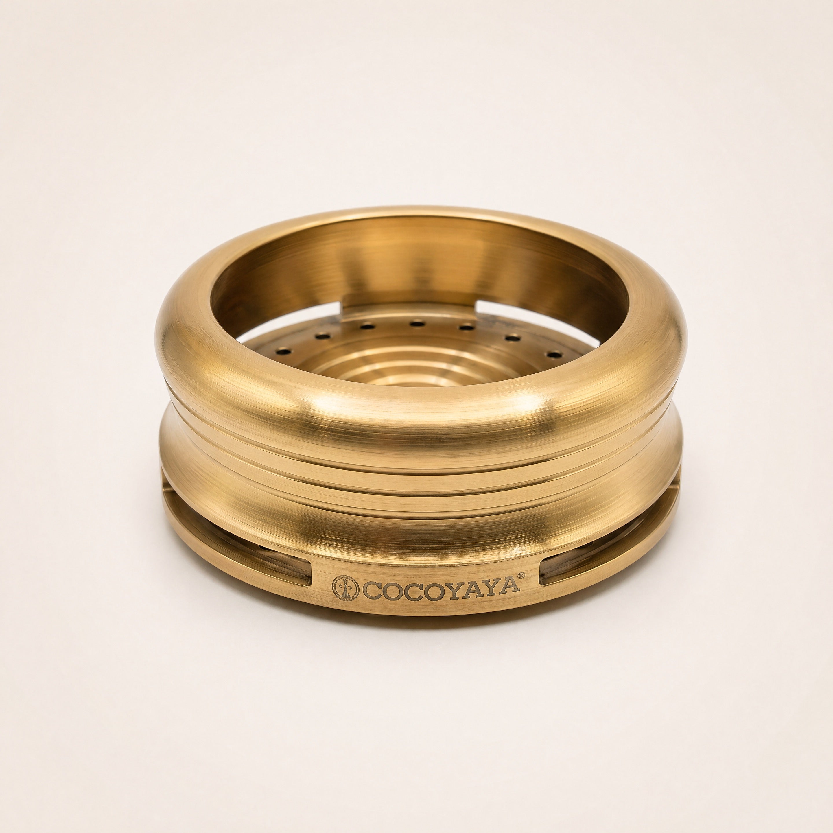 Cocoyaya Pro 5 stainless steel HMD in brushed gold finish, three-quarter studio view showing slot vents and COCOYAYA branding
