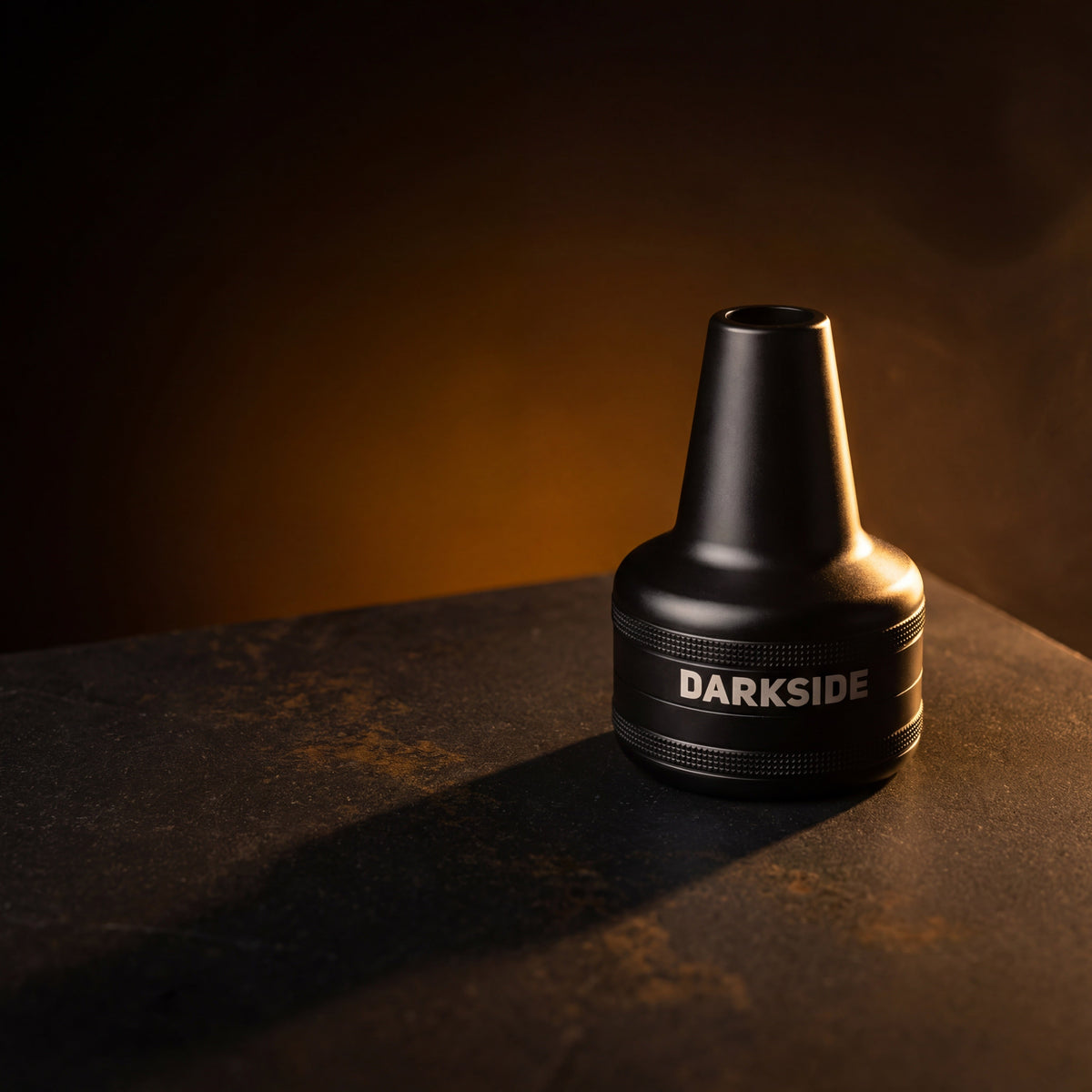 Darkside D-Catcher matte black aluminium molasses catcher on dark basalt, warm amber lighting, image 2 of 13