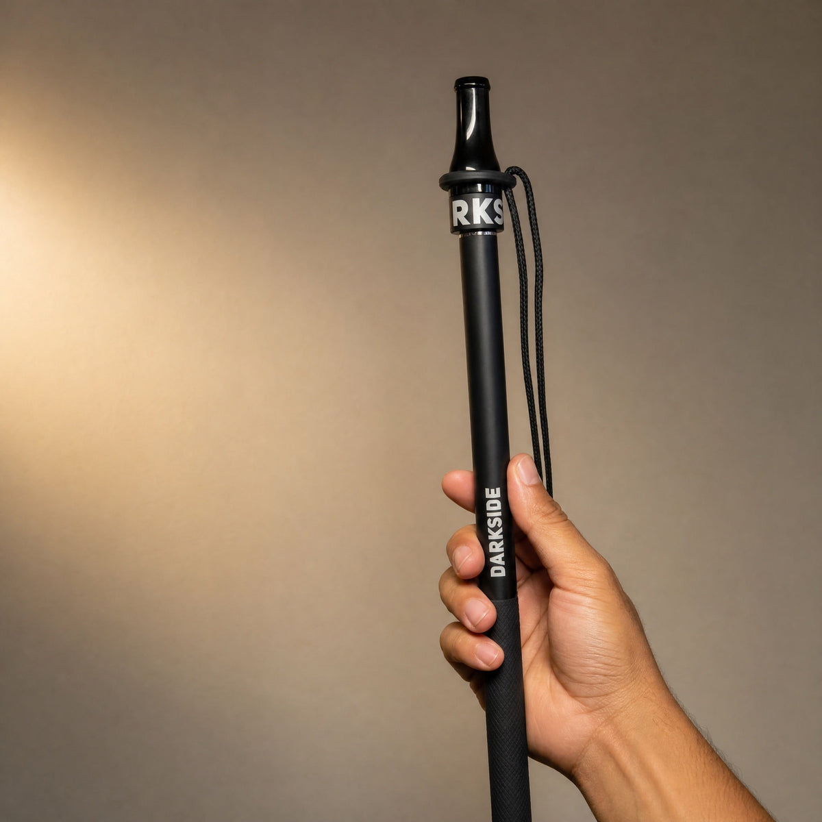 Darkside D-Stick Base mouthpiece fitted on Darkside hose handle showing universal fit, held in hand, image 3 of 7