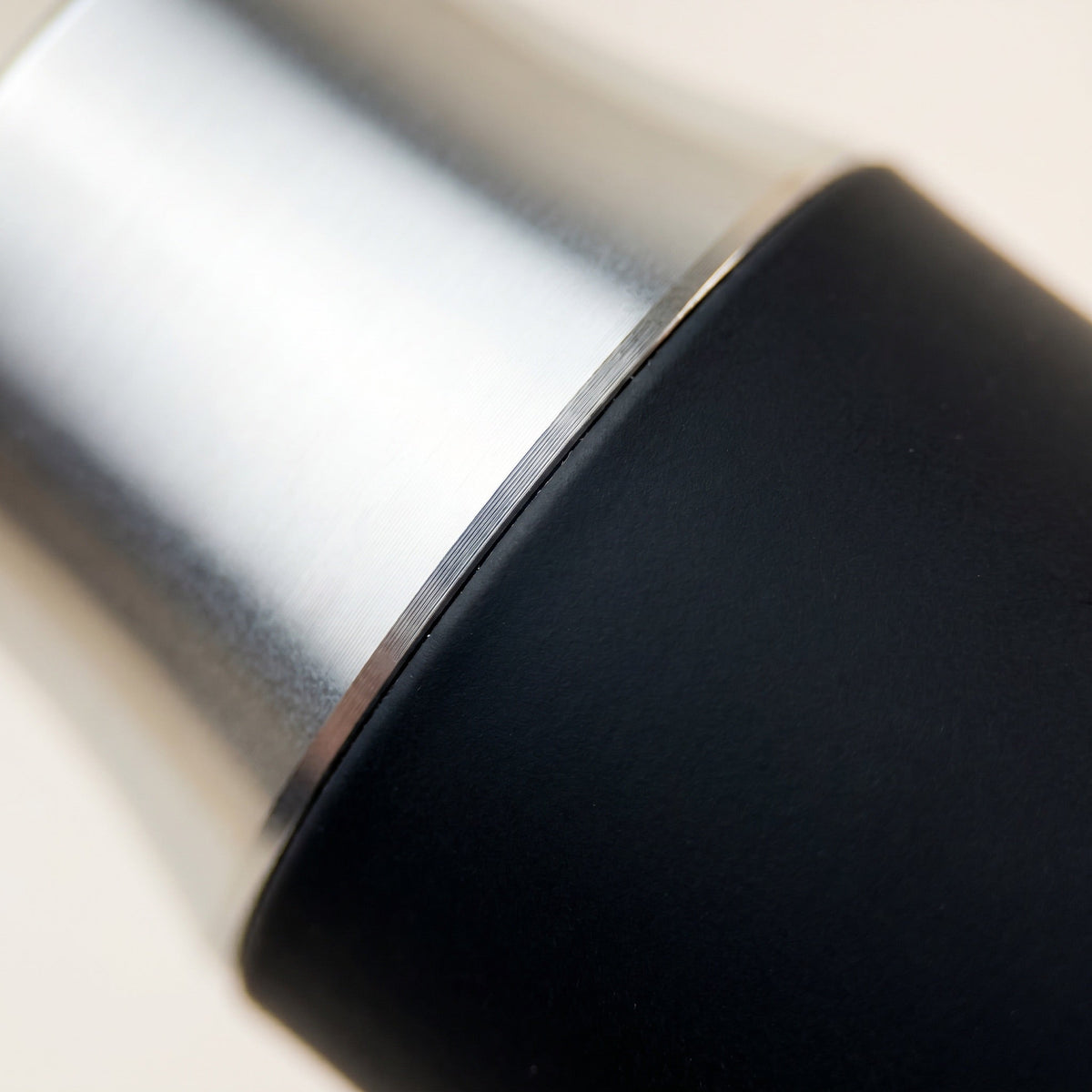Enso Hookah Mouthpiece macro of the polished aluminium collar meeting matte black silicone grip, image 7 of 12