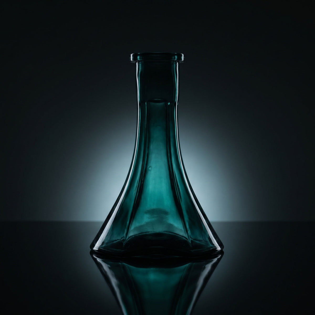 Forest Trefoil shisha vase silhouetted on dark mirror, deep green glass glowing from within, sculptural three-lobe form, image 2 of 3