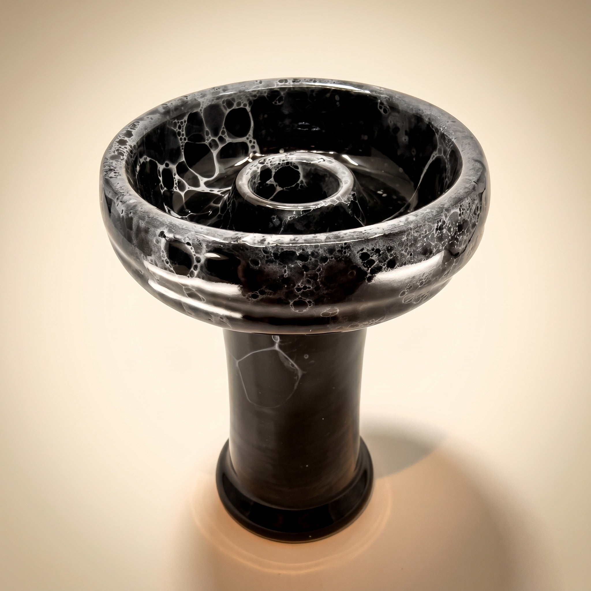 Essentials Joker Phunnel variant thumbnail — Noir glossy black with silver-grey bubble-marble glaze, cream studio backdrop.