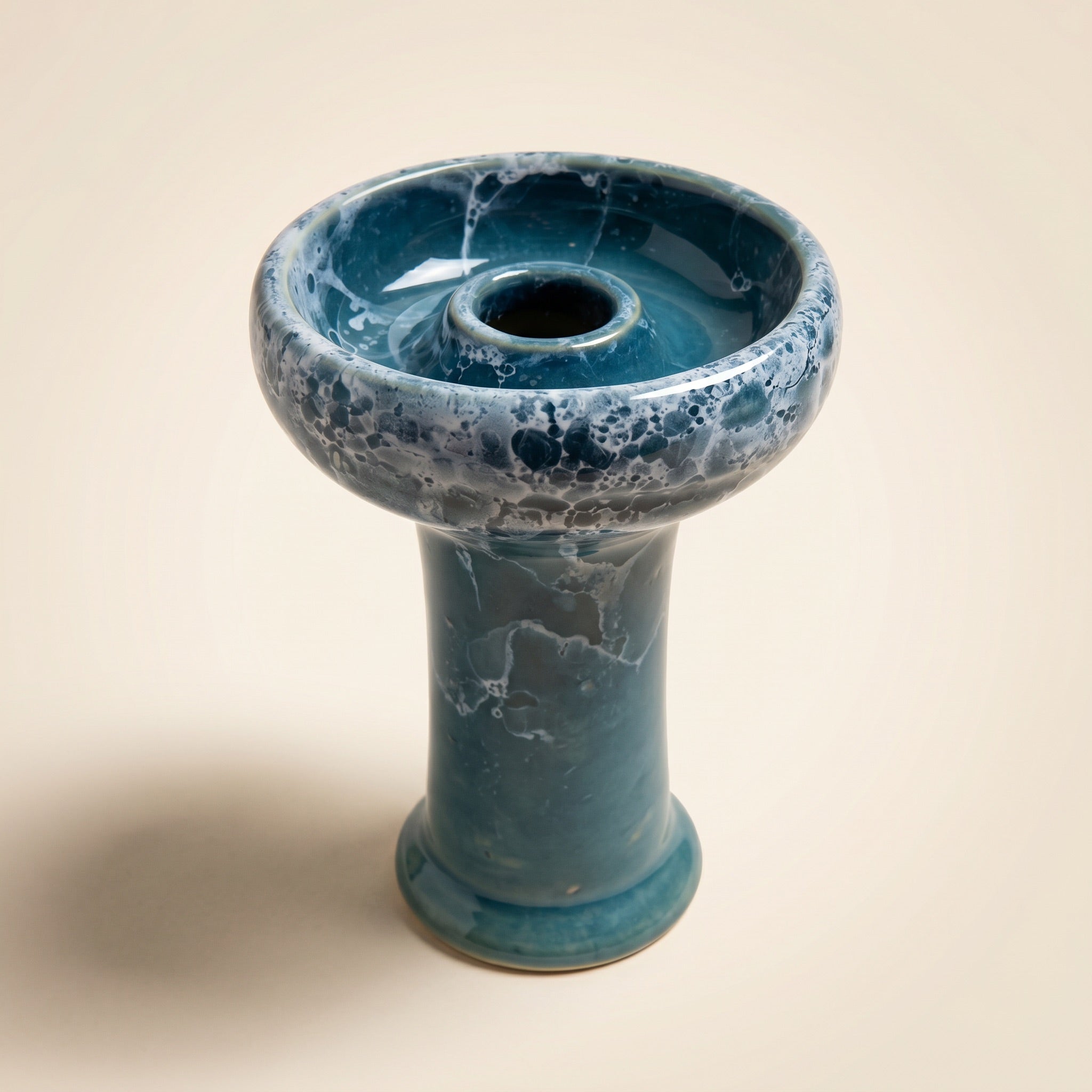 Essentials Joker Phunnel shisha bowl in Tsunami — teal ceramic with cream foam bubble-marble glaze on warm cream studio backdrop.