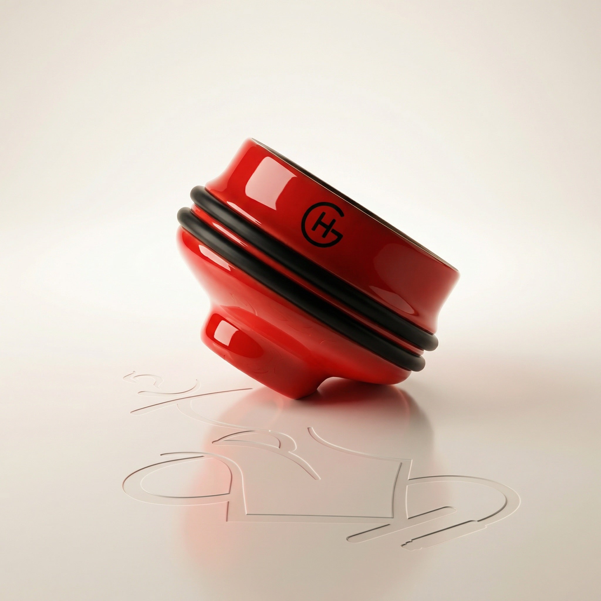 Geometry Short Phunnel Bowl in glossy red glaze with black silicone rim bands, studio front view showing compact squat ceramic hookah bowl profile.