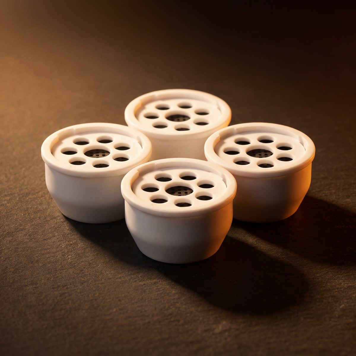 Kaloud Ayara Large filters clustered under warm amber studio light with activated carbon filters visible, image 2 of 10