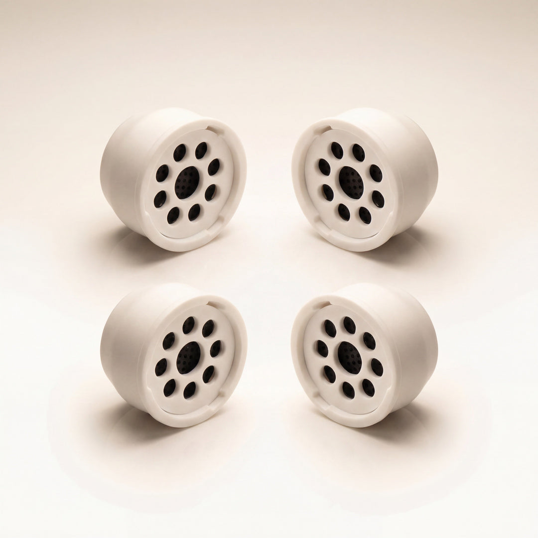 Kaloud Ayara Large replacement filters 4-pack on warm studio white, activated carbon flower-pattern filter faces
