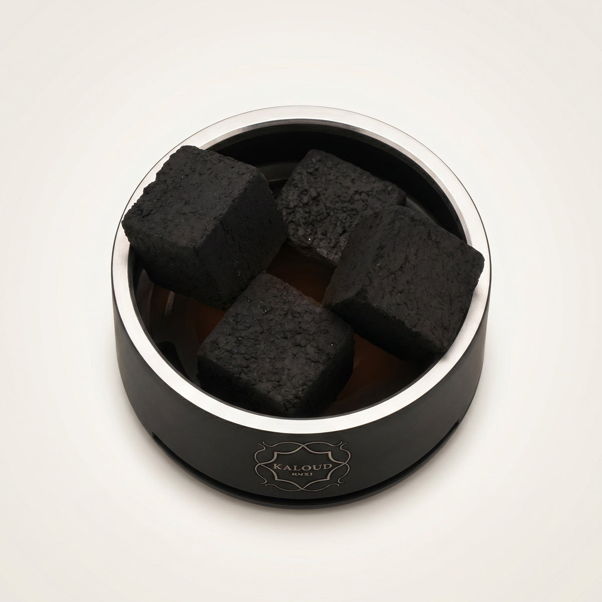 Top-down view of Kaloud Lotus I+3 Niris Black HMD chamber holding four large coconut coals, image 3 of 10