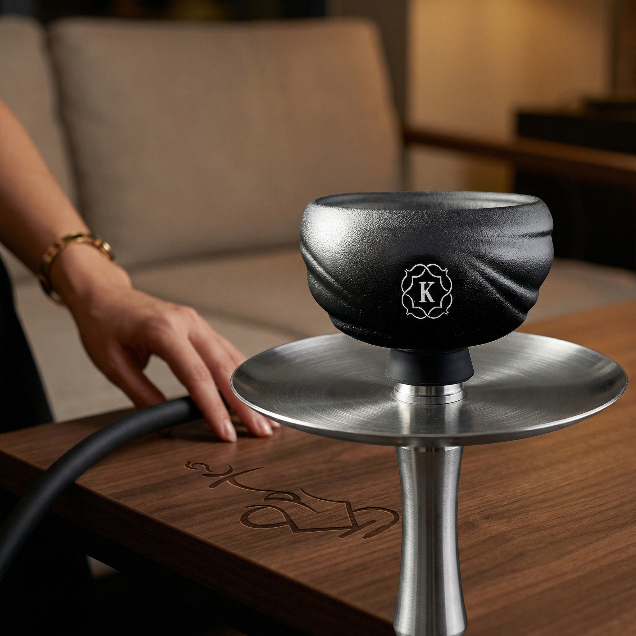 Kaloud Samsaris Kore All Ceramic shisha bowl mounted on a hookah stem above a stainless steel charcoal tray during a warm evening session