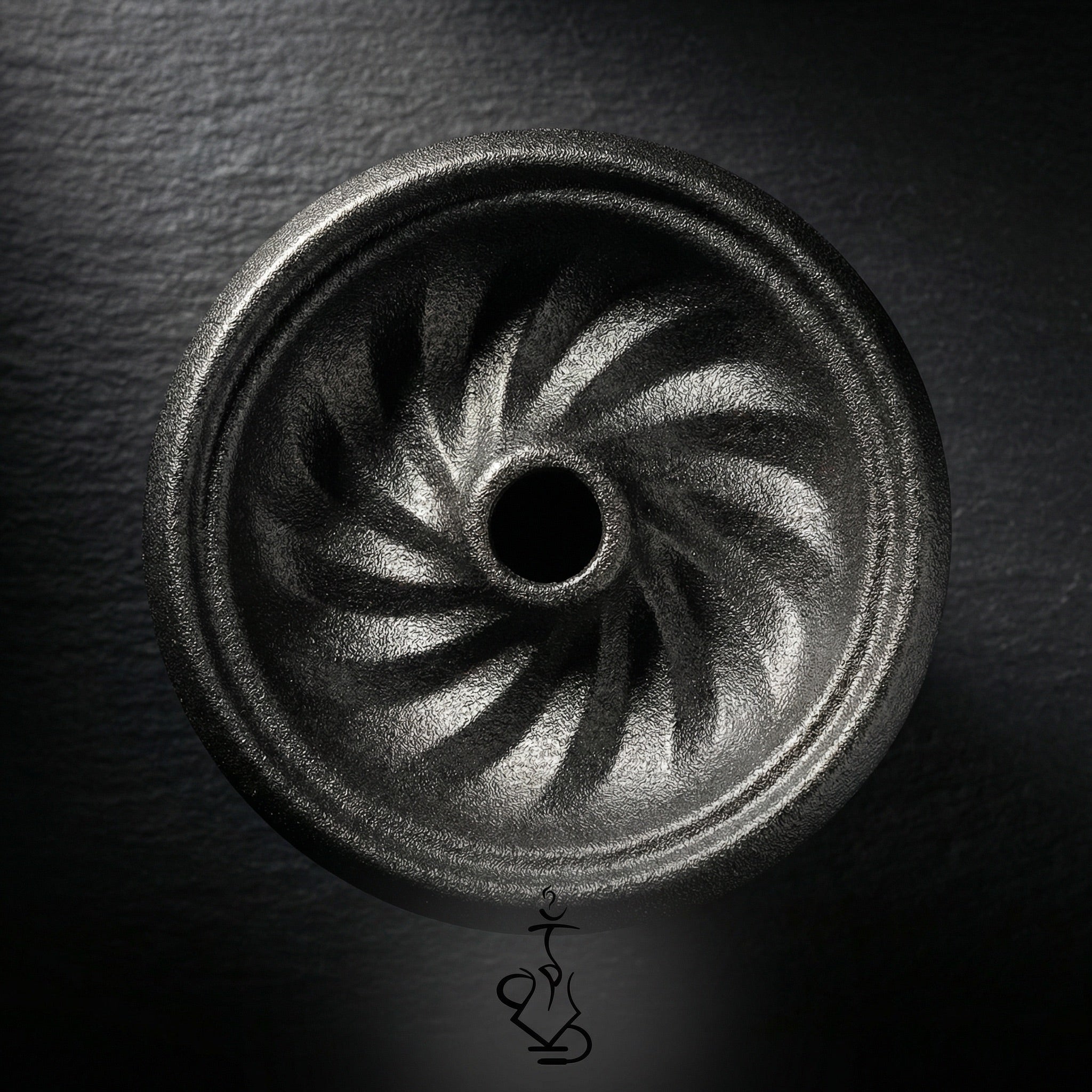 Overhead view of the Kaloud Samsaris Kore All Ceramic bowl interior showing spiralling phunnel channels in dark charcoal ceramic with metallic grain