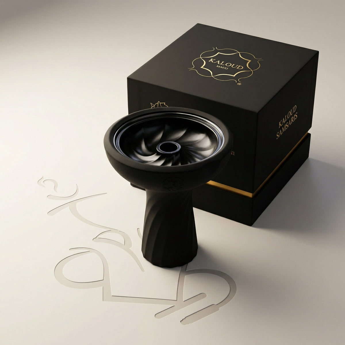 Kaloud Samsaris Lapis II shisha bowl showing glossy black glazed ceramic interior with spiralling flavour chambers alongside premium Kaloud presentation box, image 4 of 13