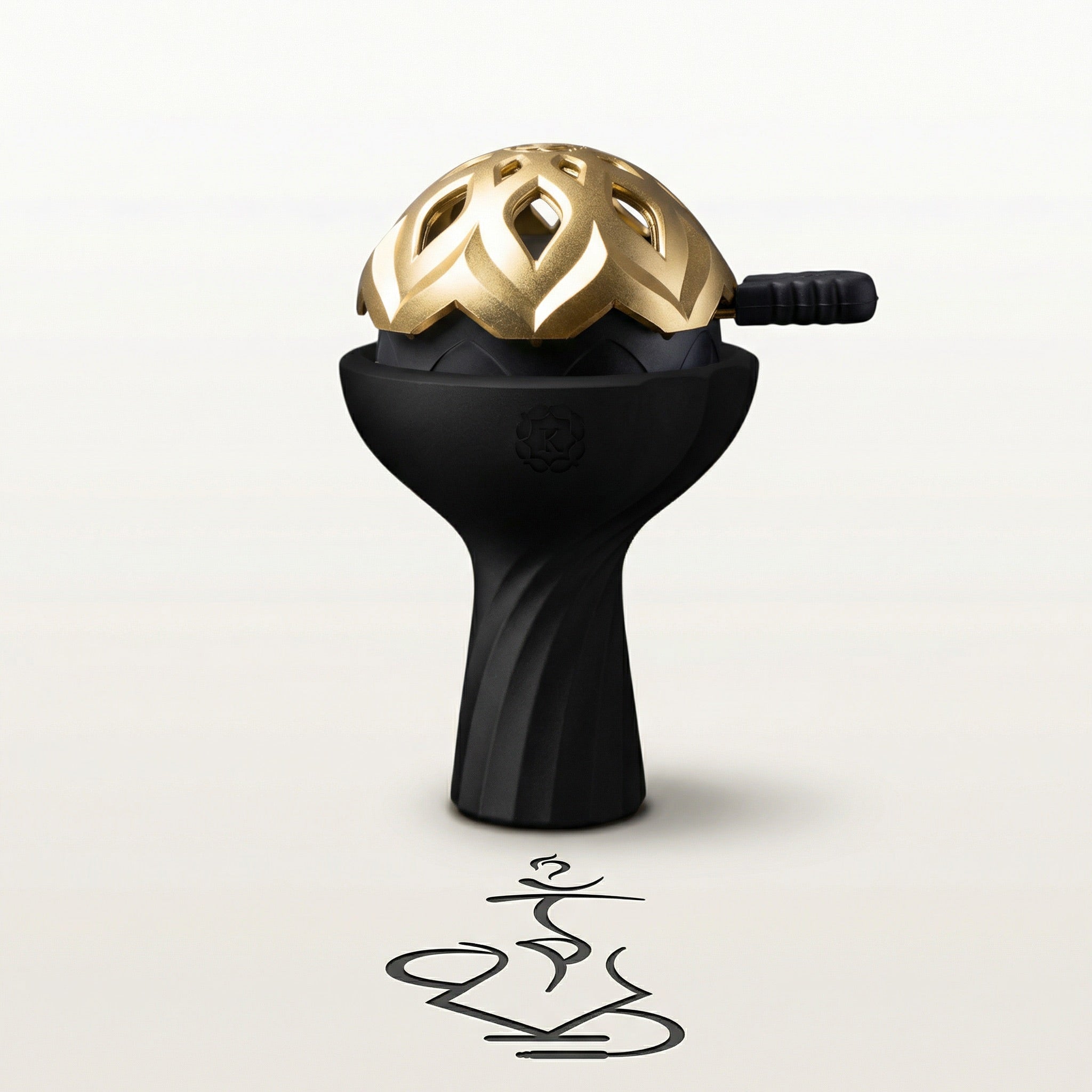 Kaloud Samsaris Lapis II ceramic shisha bowl in matte black silicone paired with gold Lotus I+3 heat management device on a warm white studio background