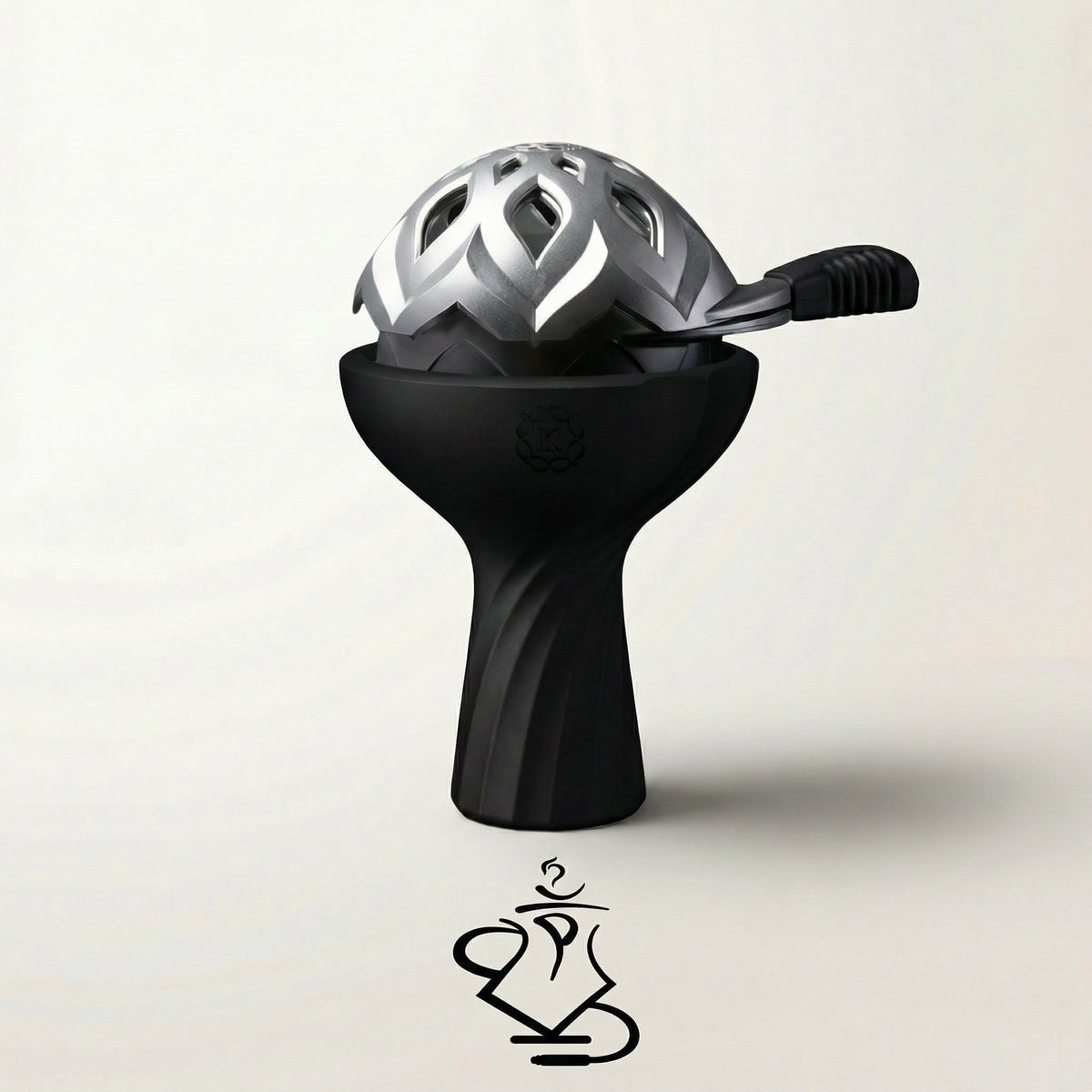 Kaloud Samsaris Lapis II ceramic shisha bowl in matte black silicone paired with silver Lotus III heat management device on a warm white studio background, image 7 of 13