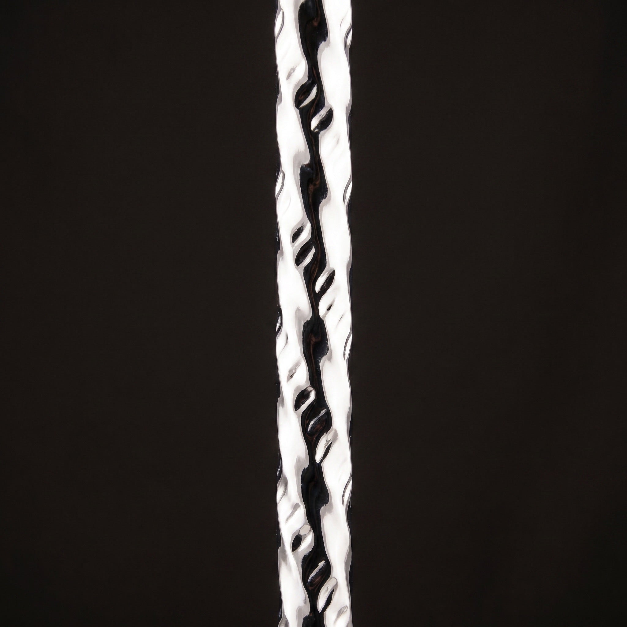 Macro detail of Khalil Mamoon Borg 4351 hand-forged hammered chrome stem texture