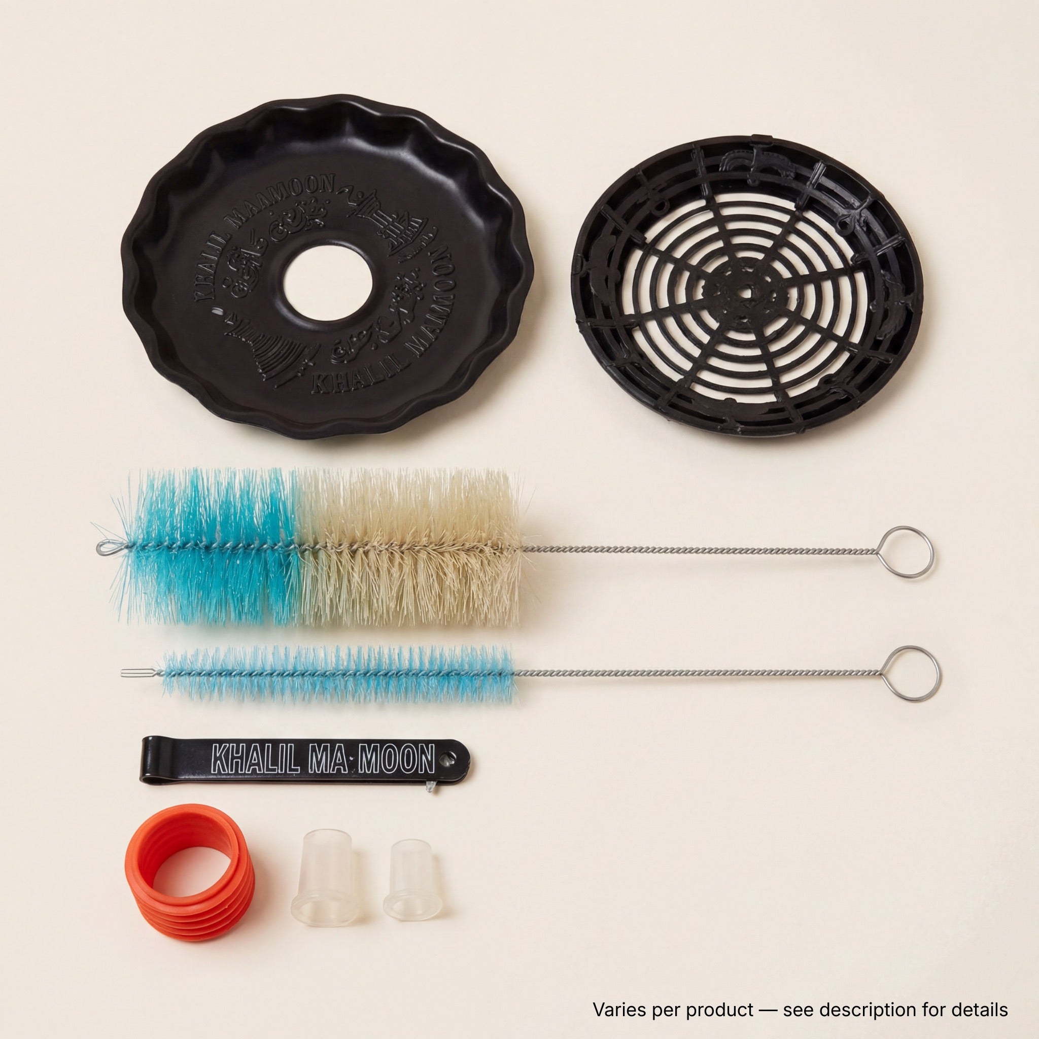 Khalil Mamoon included accessories — cleaning brushes, fluted base mat, spider diffuser, branded tongs and hose grommets