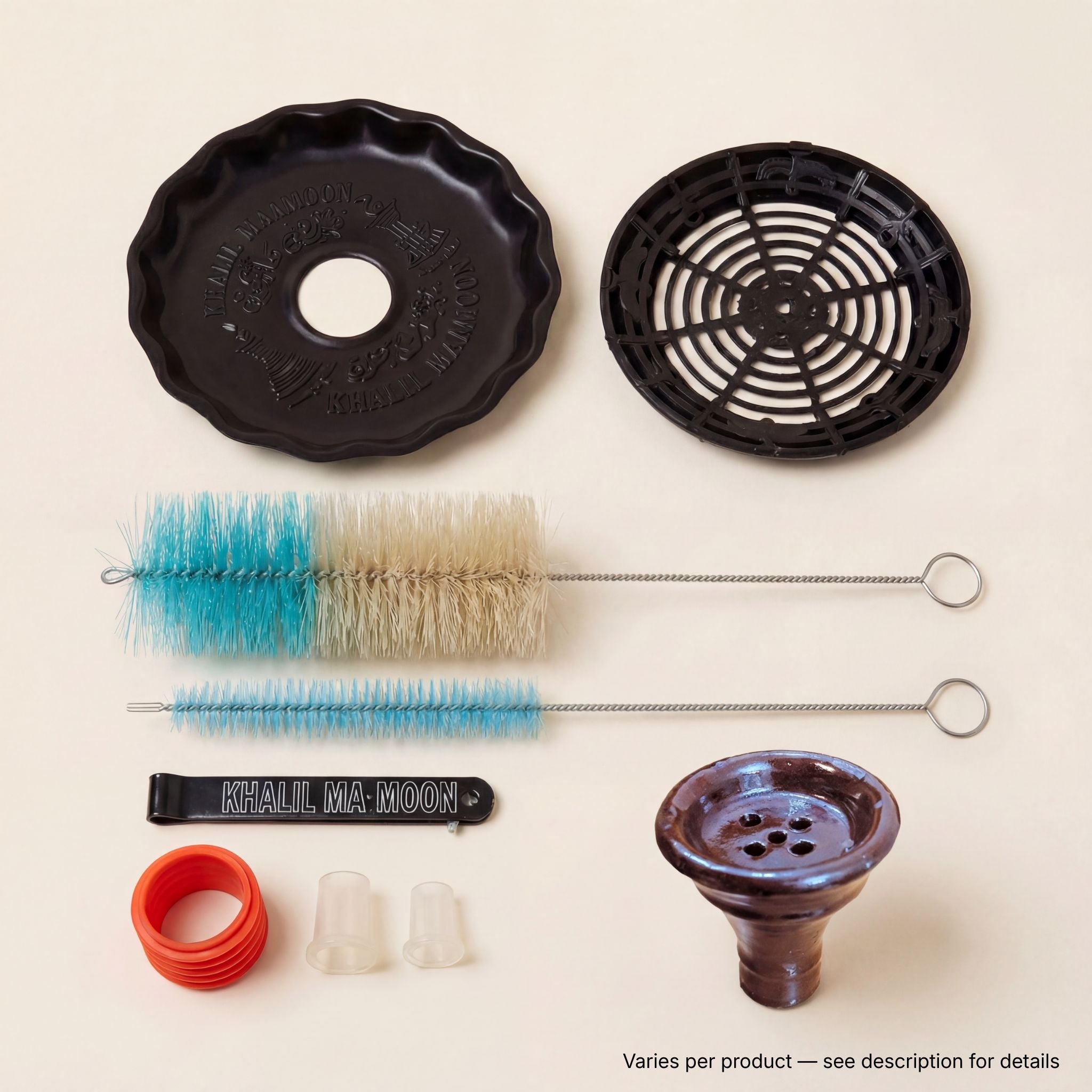 Khalil Mamoon included accessories — cleaning brushes, fluted base mat, spider diffuser, branded tongs and hose grommets