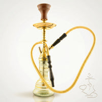 Khalil Mamoon Mini Beast Star Safari Gold 52 cm handmade Egyptian hookah pipe with gold-plated stem, clear glass base with gold striping, and traditional clay bowl, photographed on a warm white studio background.
