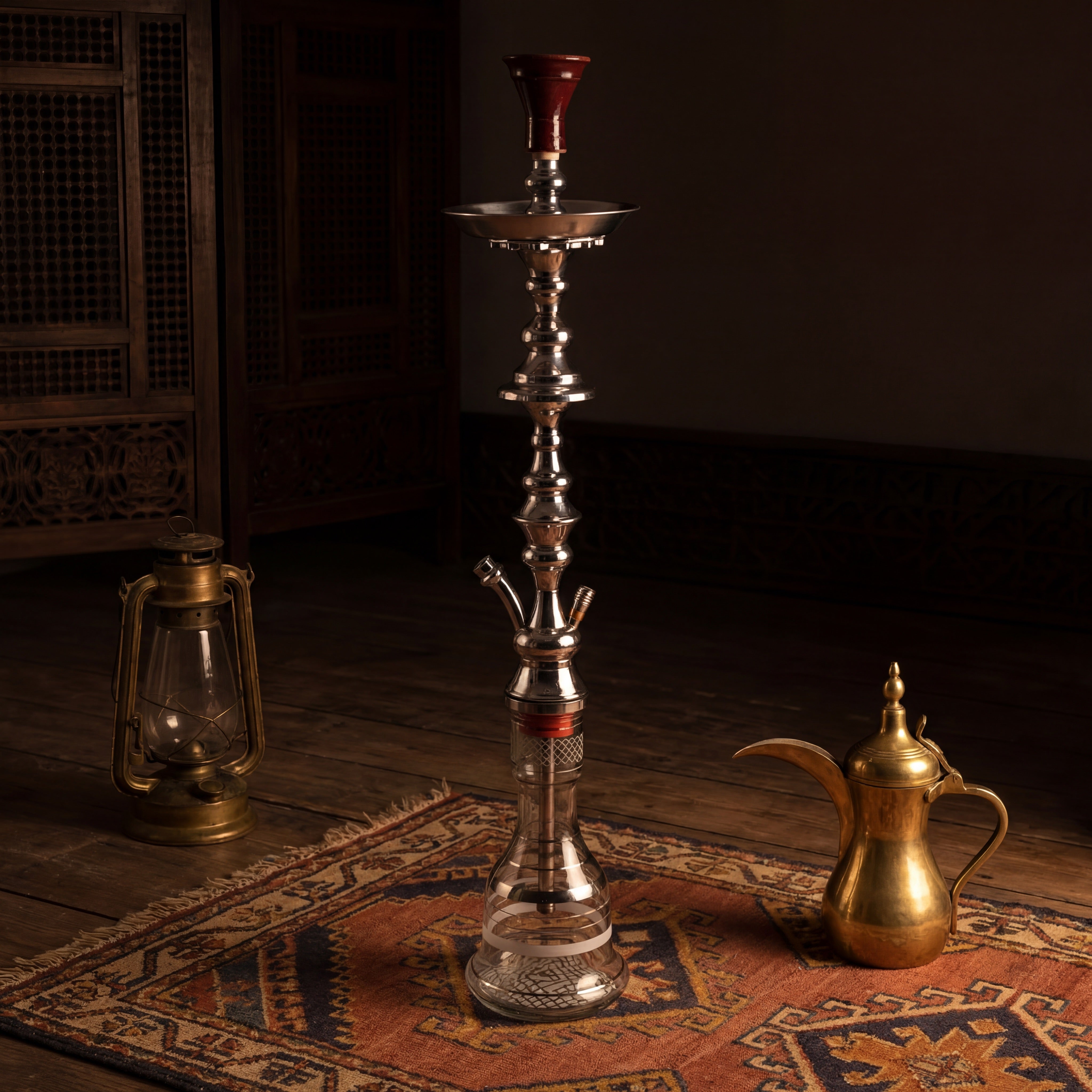Khalil Mamoon Shareef Silver 79cm hookah in a majlis setting with brass dallah and oil lantern on a kilim rug