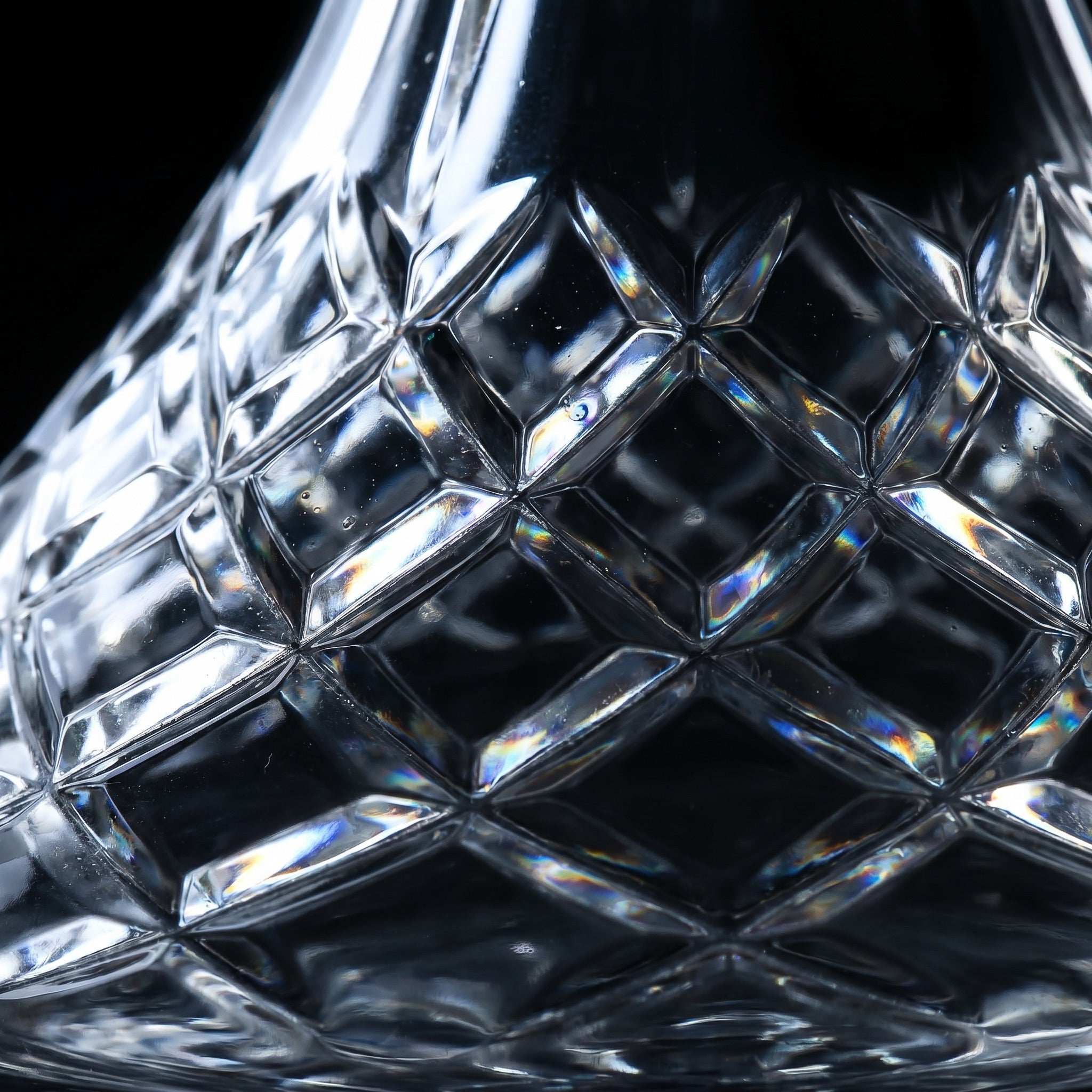 Macro detail of Lismore diamond-cut lattice with prismatic facet highlights on cut-crystal hookah base