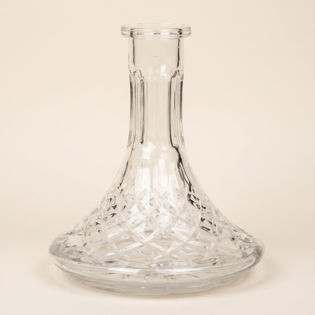 Lismore crystal-cut glass hookah base showing full diamond-cut lattice on warm cream studio backdrop