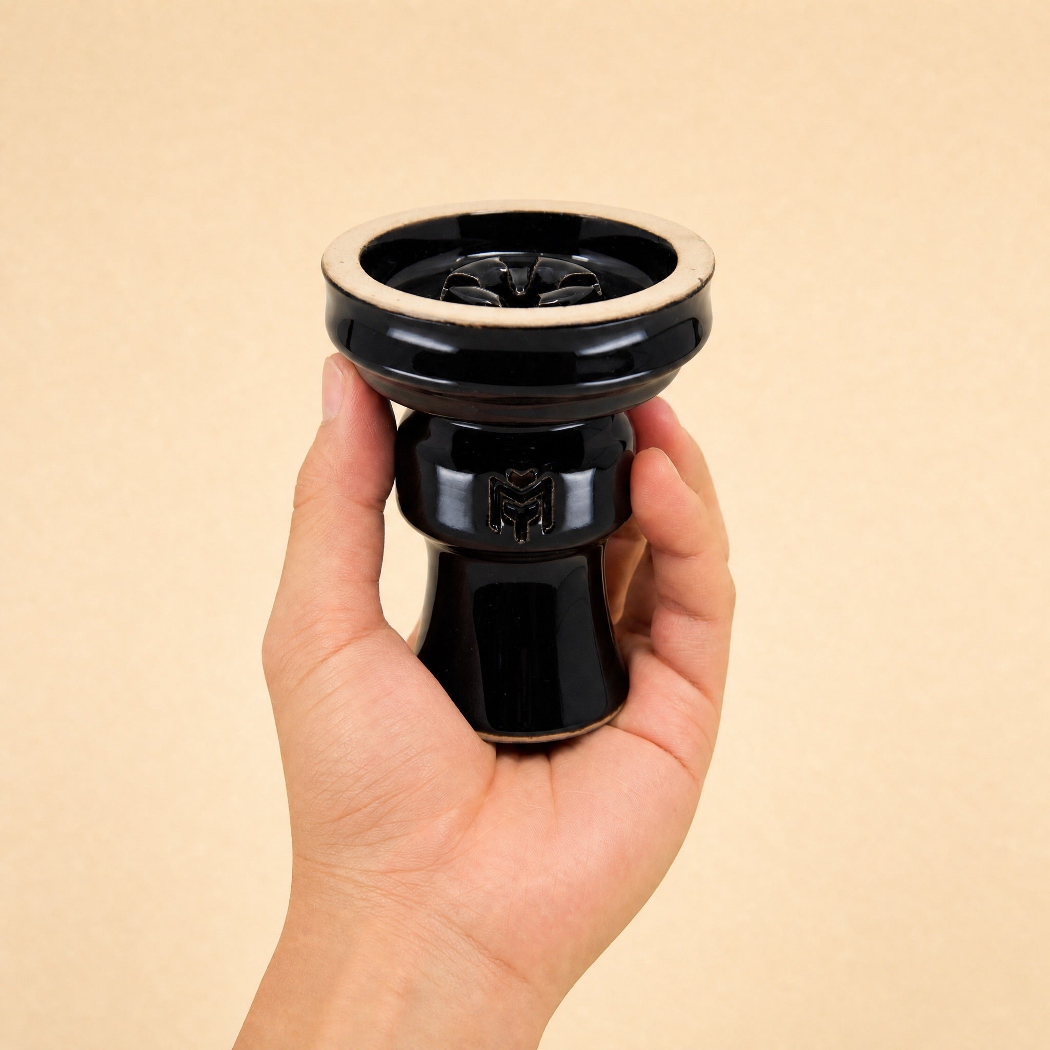 MIT Luxury Ashera Eclipse bowl held in hand, showing scale and glossy obsidian-black glaze finish