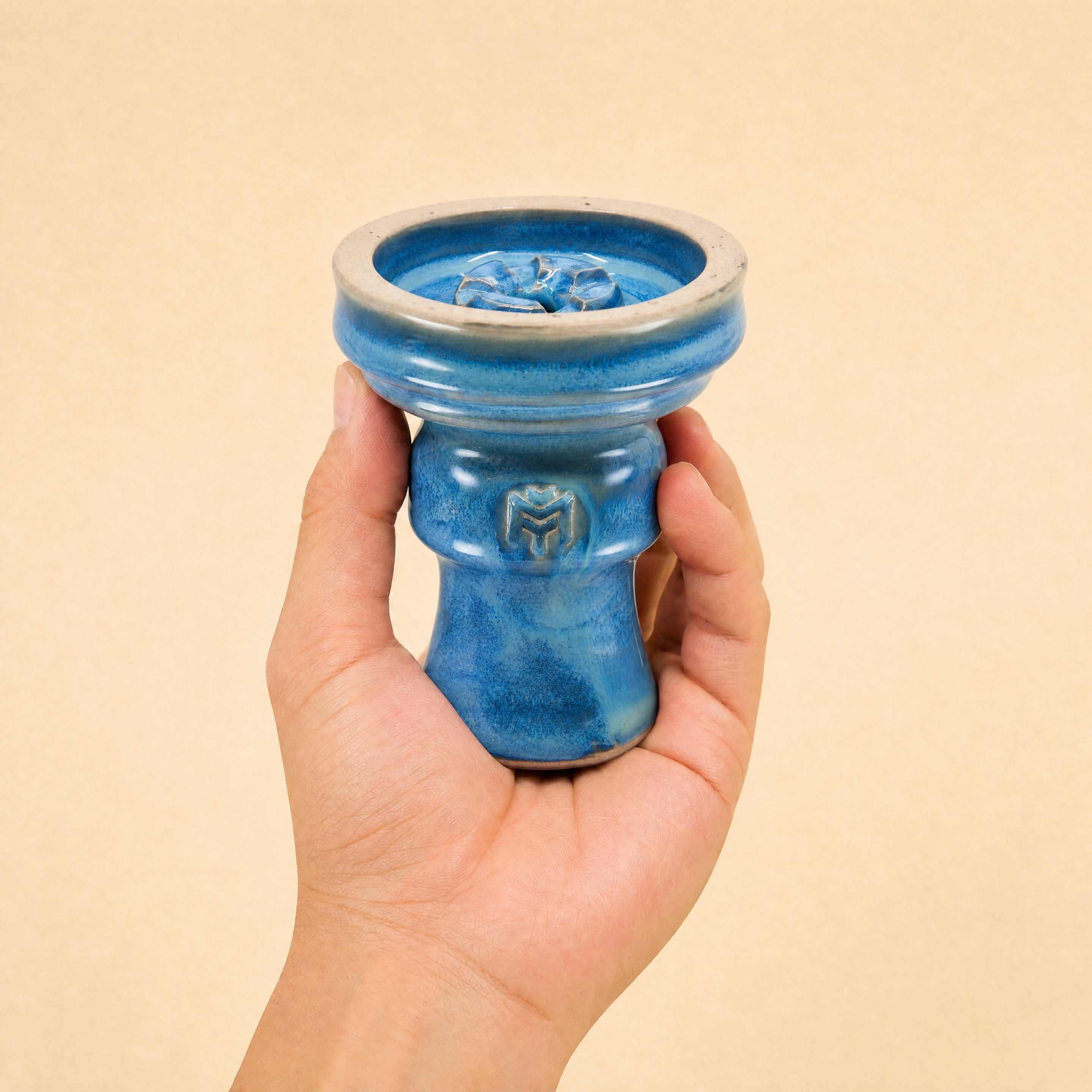 MIT Luxury Ashera Tide bowl held in hand, showing scale and azure-blue mottled glaze finish