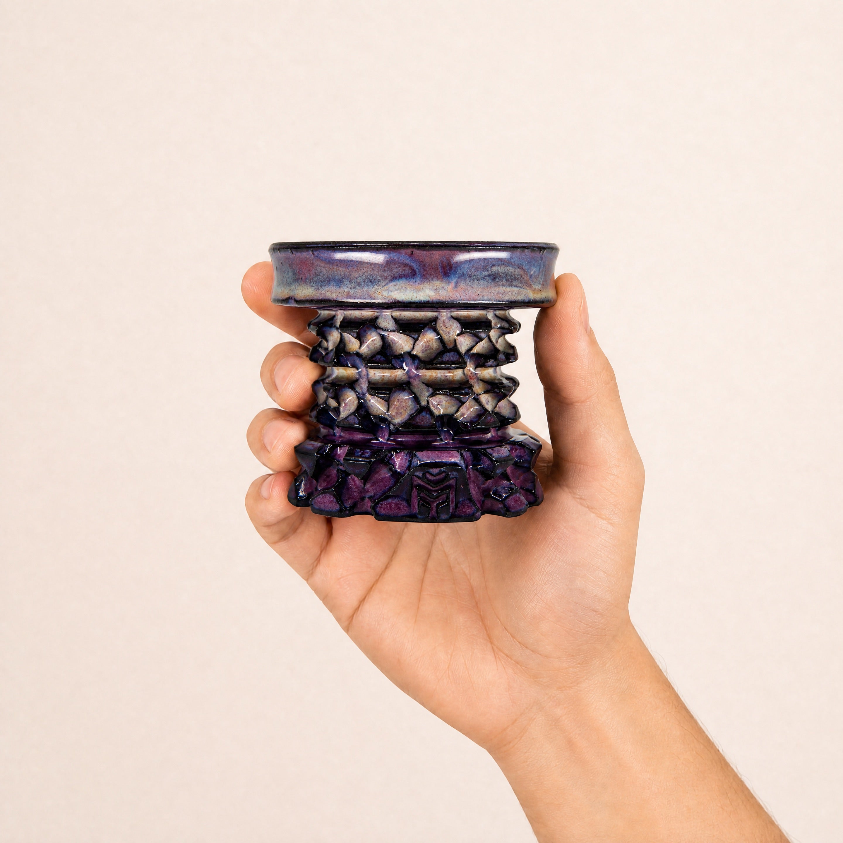 MIT Luxury Mitovation V2 Amethyst bowl held in hand, showing 80mm scale and amethyst glaze with lavender plate