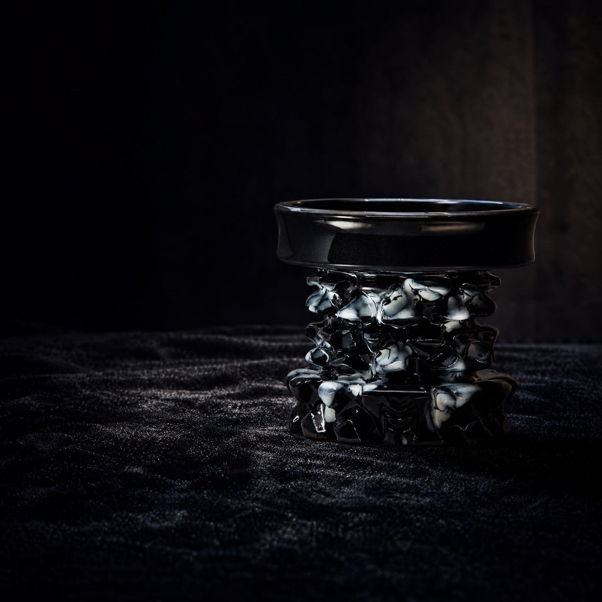MIT Luxury Mitovation V2 Onyx bowl on black velvet vitrine, gallery specimen lit by single directional spotlight, image 2 of 6