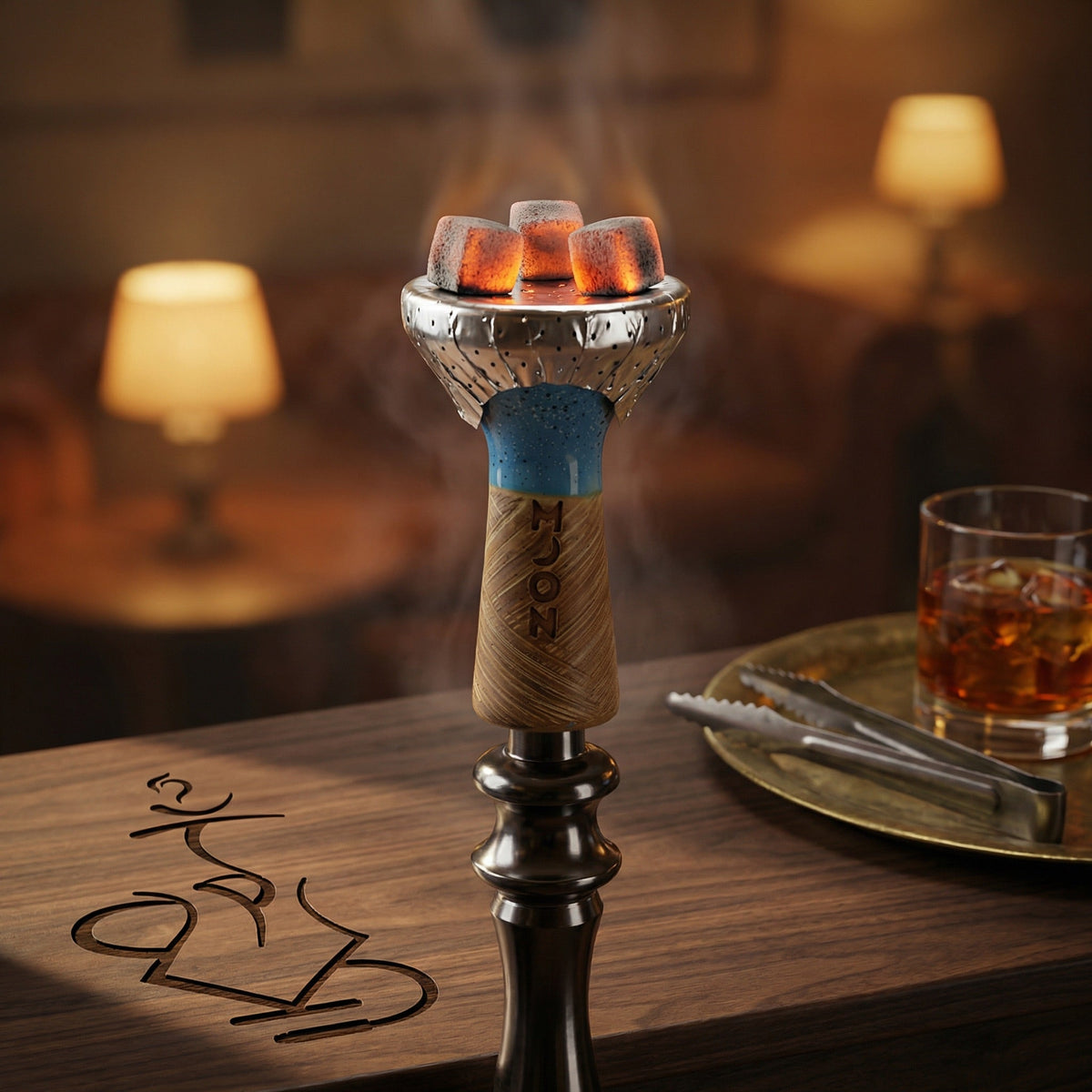 Hand using metal tongs to place a glowing coconut coal onto foil over a Moon Phunnel blue glazed bowl mounted on a hookah, captured in a warm lounge setting., image 8 of 11