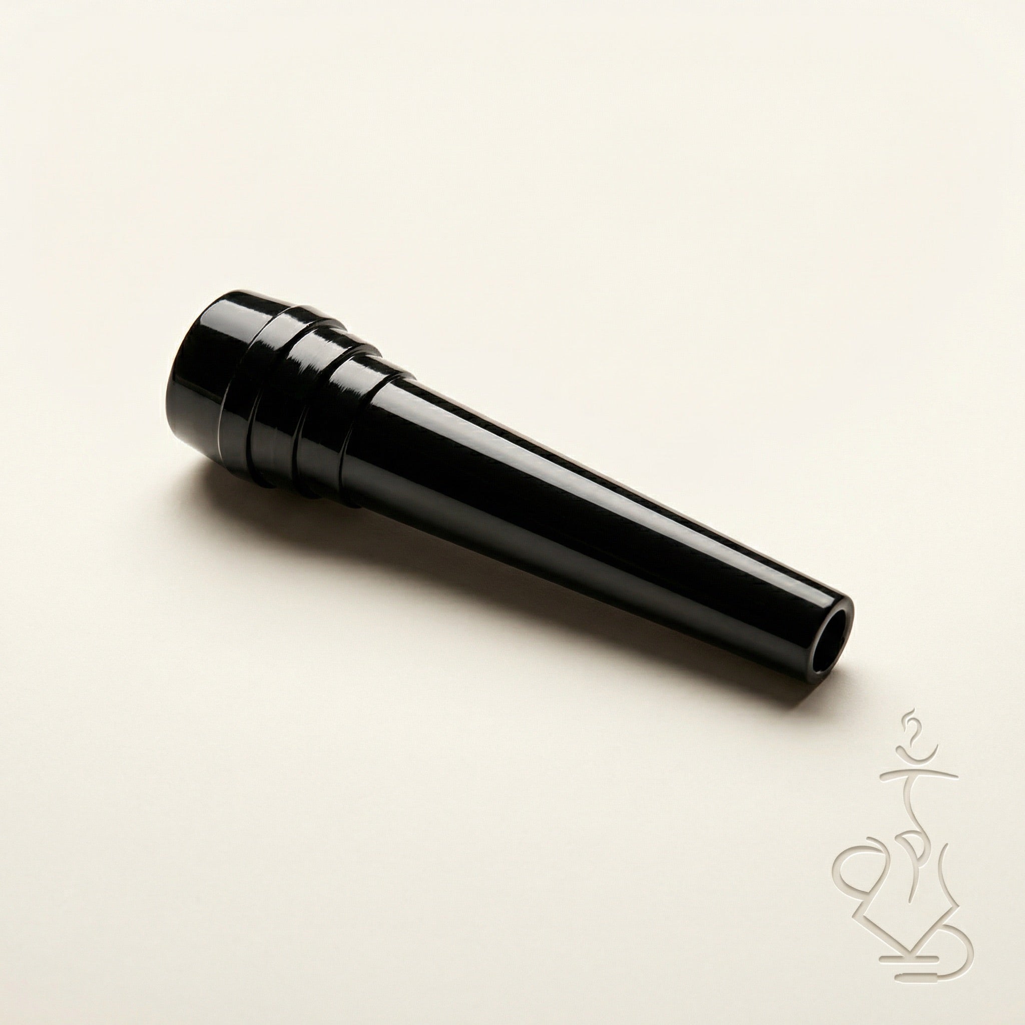 ShishaDoc disposable hookah mouth tip in short glossy black on warm white studio background