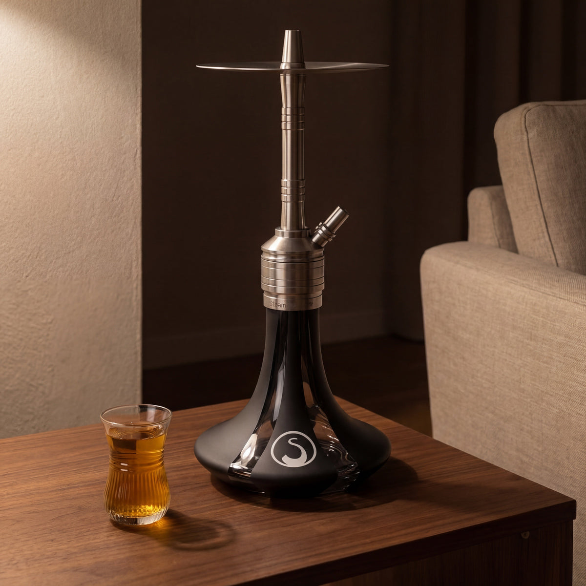 Steamulation Mini Gen II Black Matt hookah on walnut side table with Arabic tea glass, The Premium Shisha, image 2 of 12