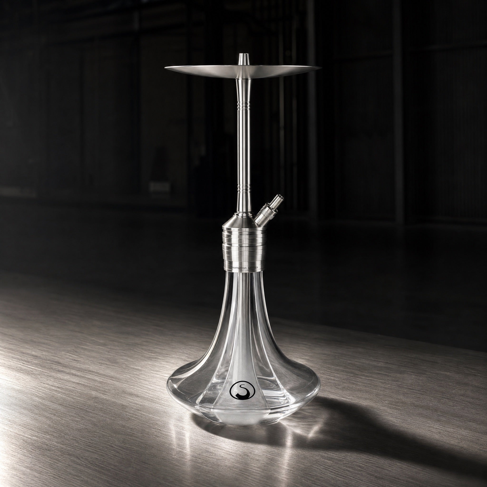 Steamulation Ultimate One Gen II in White Matt photographed against dark workshop interior with cool side lighting