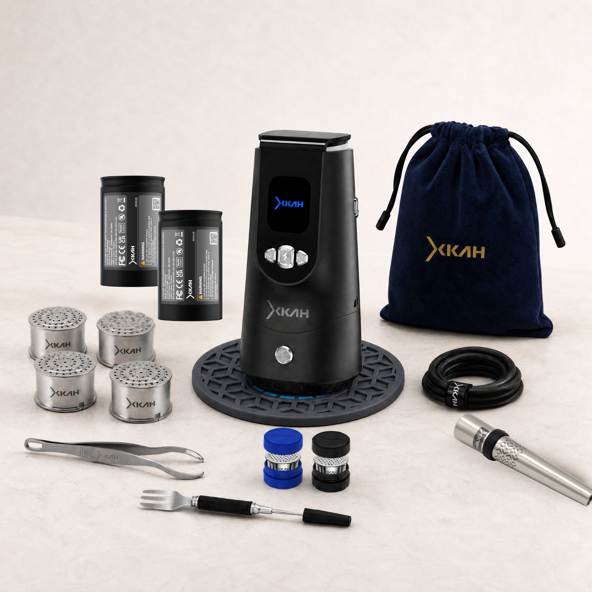 XKAH Pro Master Kit complete bundle display — eHMD on 320° base mat with twin batteries, four pods, two pod carry cases, stainless mouthpiece, tongs, fork poker, USB-C cable and travel bag — The Premium Shisha