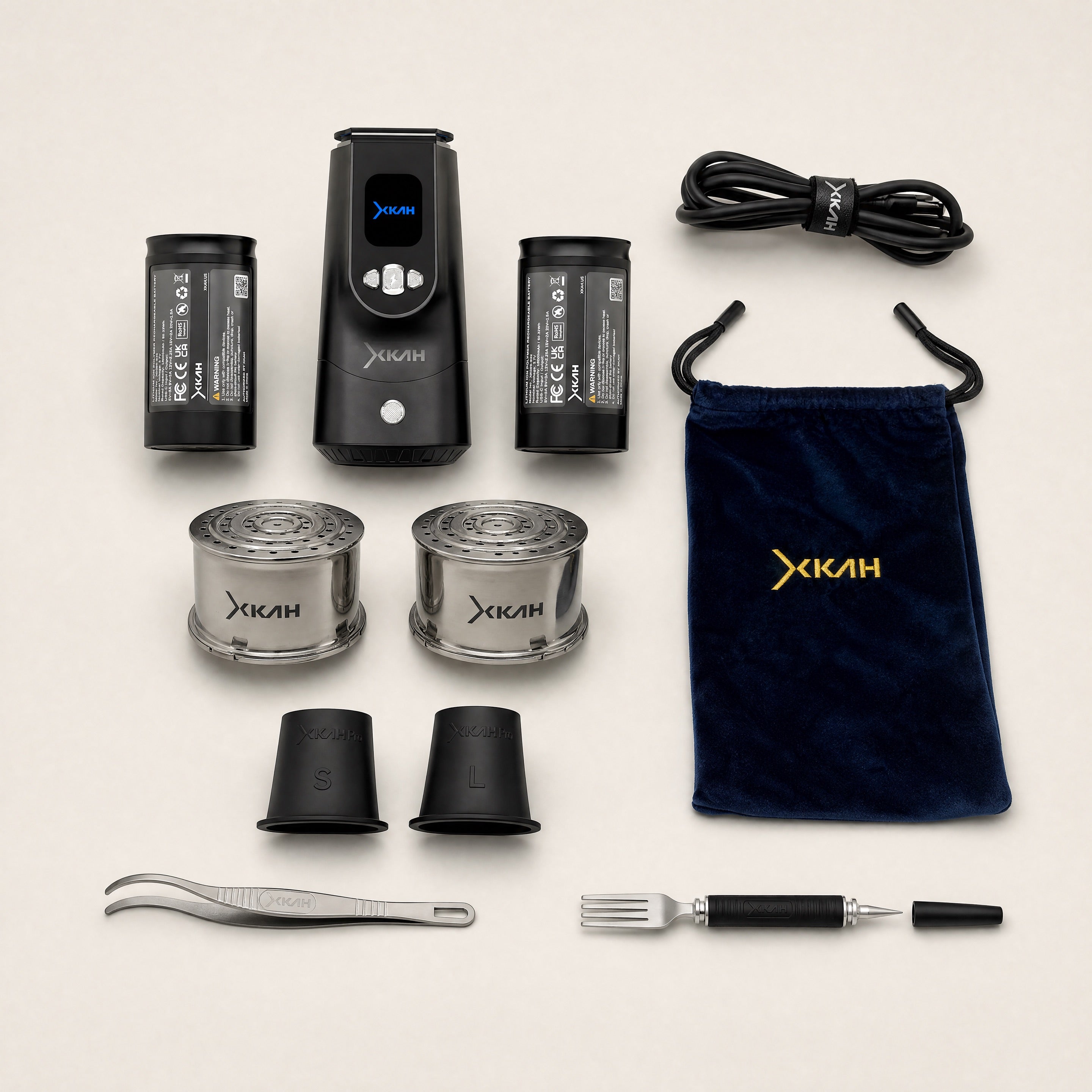 XKAH Pro Power Bundle full contents flat lay — eHMD, two 13,600 mAh batteries, two stainless steel pods, S and L grommets, USB-C cable, tongs, fork poker and travel bag — The Premium Shisha